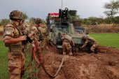 In this file photo, French soldiers of the &#39;Belleface&#39; Desert Tactical Group (GTD) try to move an all-terrain armoured vehicle during Operation Barkhane in Ndaki, Mali [File: Reuters]