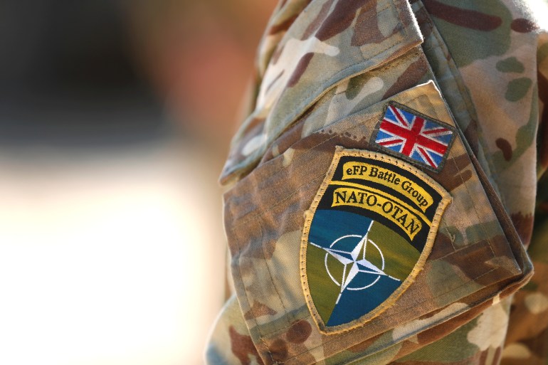 A close up of the badge of the British troops of NATO enhanced Forward Presence battle group based in Estonia on the upper arm of a military uniform