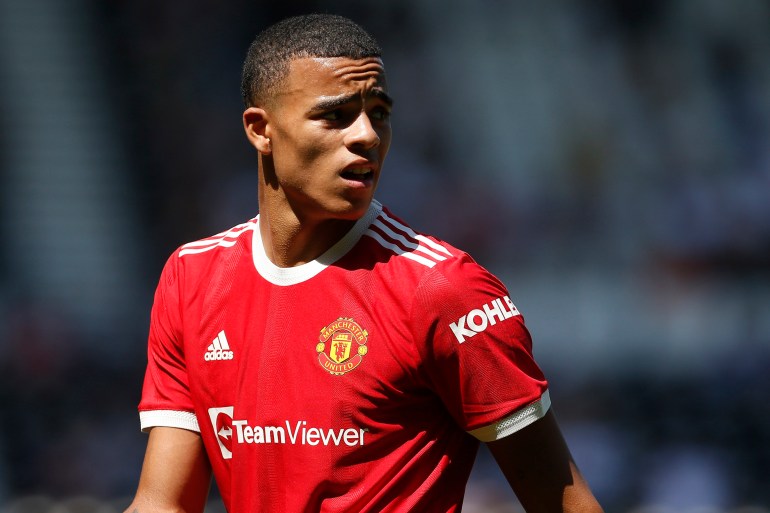 mason greenwood looks on during a football match