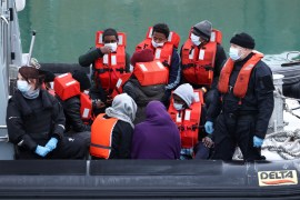 Migrants and refugees are brought into the United Kingdom's Dover harbour onboard a Border Force rescue boat