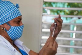 A nurse prepares a booster dose of the Abdala vaccine against COVID-19 in Havana, Cuba