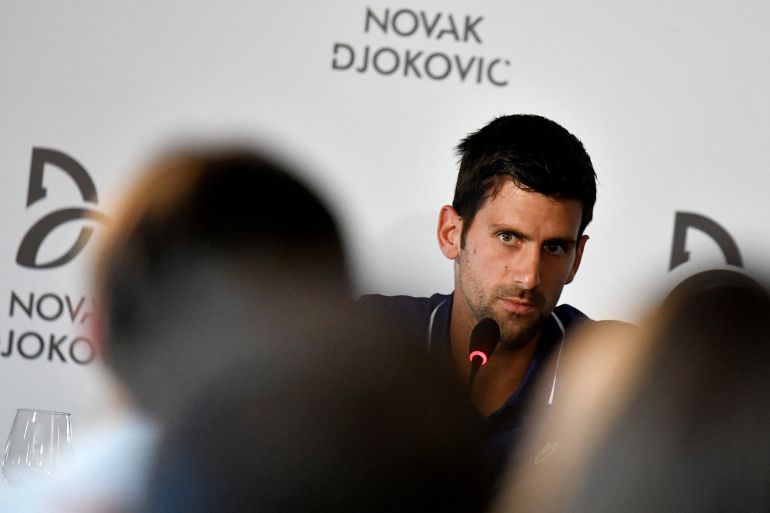 Novak Djokovic speaking at a news conference