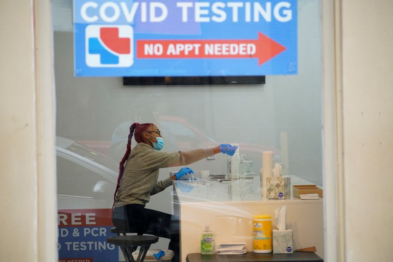 A healthcare worker sits a COVID19 testing centre.