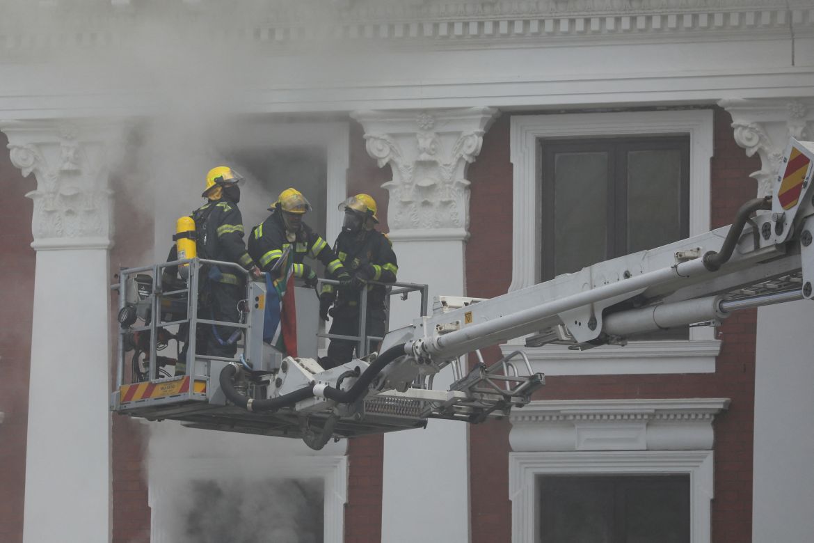 Firefighters try to extinguish flames at the South African Parliament