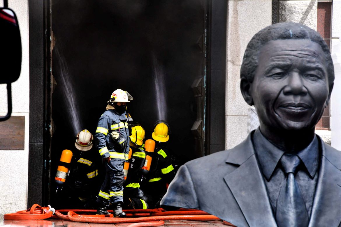 Firefighters try to extinguish flames at the South African Parliament