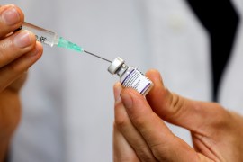 COVID vaccine needle