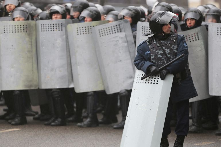 Kazakh security forces block a street in the country's main city of in Almaty