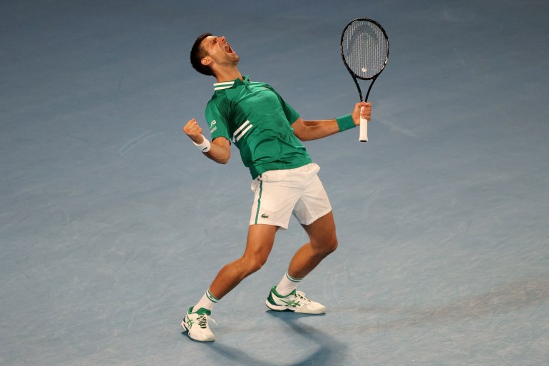 Novak Djokovic celebrates after winning match against Taylor Fritz