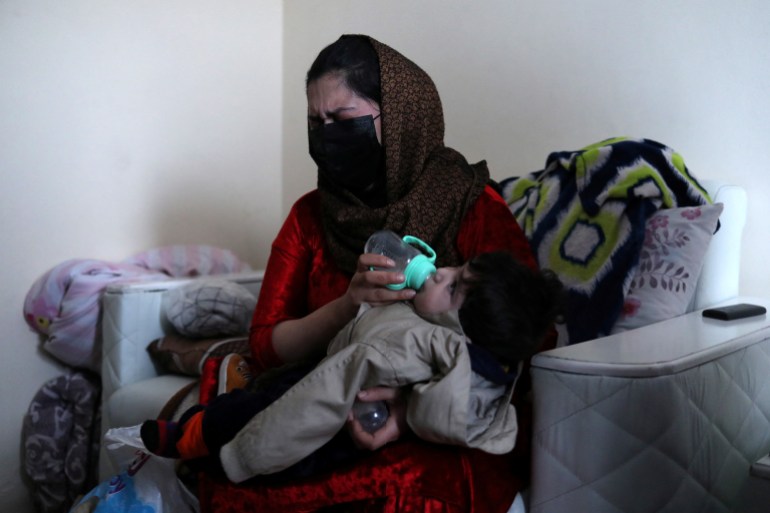 Afghan baby loses in US airlift chaos reunited with family