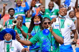 Fans of the Sierra Leone national football show their support in the stadium