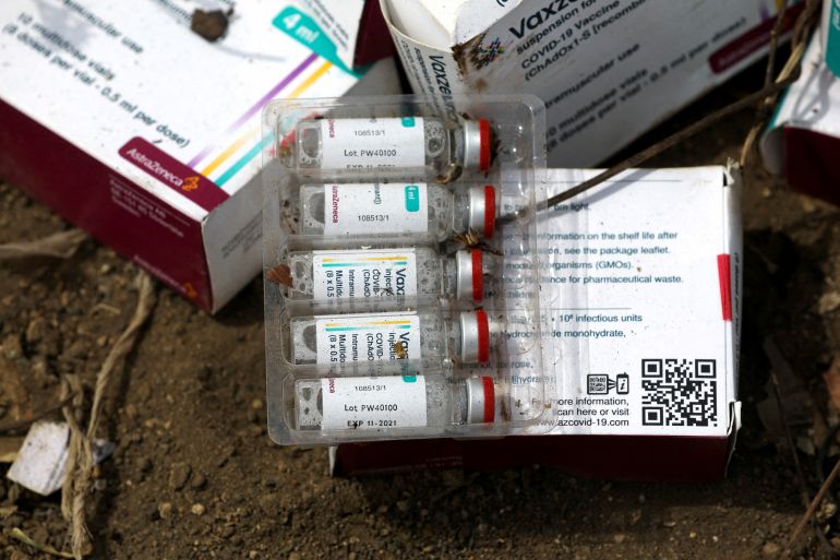 The expiry date '11-2021' is seen on a vial of the AstraZeneca coronavirus disease (COVID-19) vaccine at the Gosa dump site in Abuja
