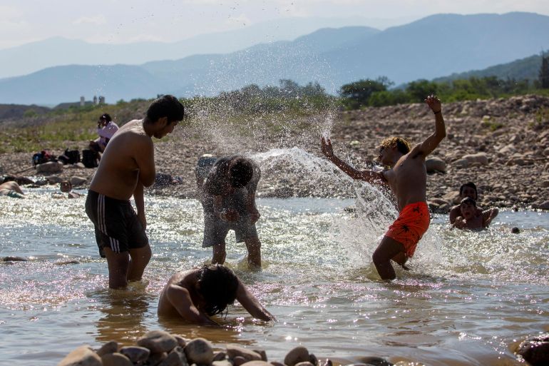 Argentines splash in a river amid record heat