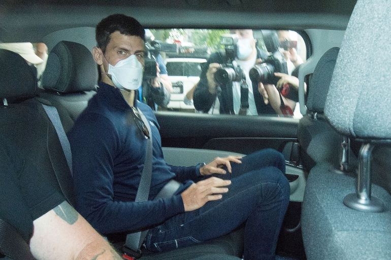 Serbian tennis player Novak Djokovic departs from the Park Hotel government detention facility before attending a court hearing at his lawyers office in Melbourne, Australia, January 16, 2022.