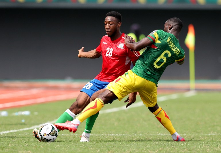 Soccer Football - Africa Cup of Nations - Group F - Gambia v Mali - Limbe Omnisport Stadium, Limbe, Cameroon - January 16, 2022 Gambia's Ebou Adams in action with Mali's Massadio Haidara REUTERS/Mohamed Abd El Ghany