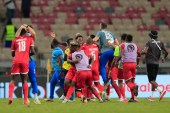 Equatorial Guinea players celebrate after their victory against Algeria [Thaier Al-Sudani/Reuters]
