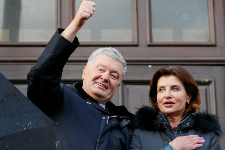 Former Ukrainian President Petro Poroshenko with his wife Maryna outside a court after a hearing in Kyiv, Ukraine
