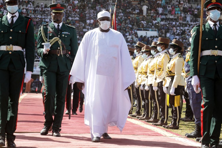 Gambia's President Adama Barrow walks during his inauguration ceremony at the Presidential Palace in Banjul, Gambia