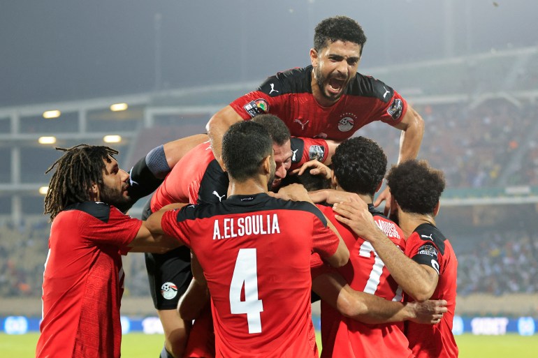 January 19, 2022 Egypt's Mohamed Abdelmonem celebrates scoring their first goal with teammates