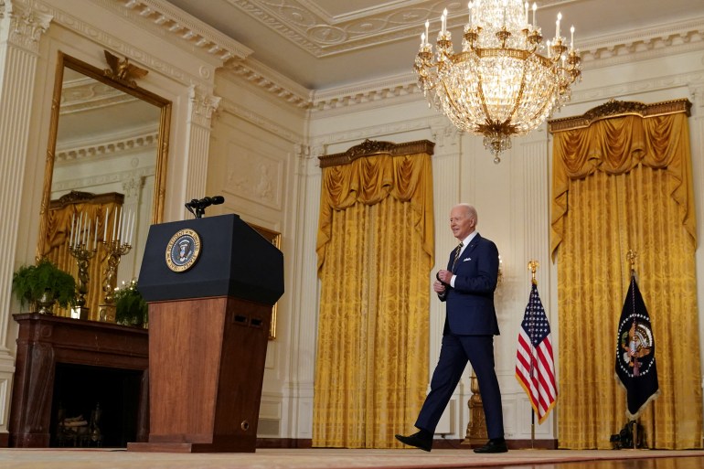 Joe Biden walks to a podium at the White House
