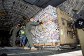 Australian Defence Forces members unload humanitarian assistance and engineering equipment from an aircraft at Fua&#39;amotu International Airport in Tonga on Thursday [Australian Department Of Defence/Handout via Reuters]