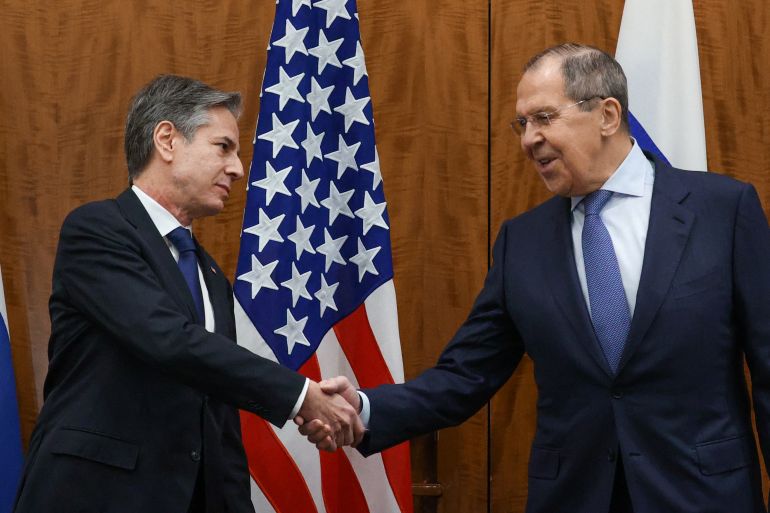 US Secretary of State Antony Blinken greets Russian Foreign Minister Sergei Lavrov before their meeting, in Geneva, Switzerland