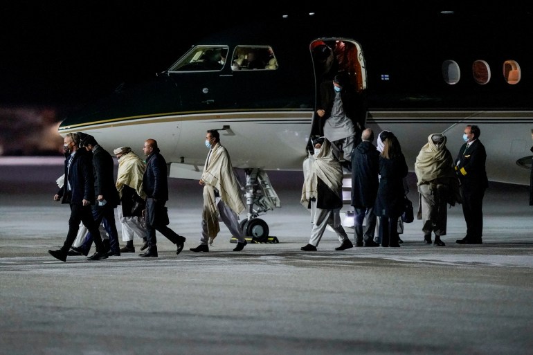 Taliban delegation exit airplane in Norway