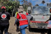 Tonga continues to cautiously receive aid from several countries, while also trying to avoid spreading COVID-19 in the tiny Pacific island nation, which has never had an outbreak [Tonga Red Cross Society/Handout via Reuters]