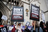 Supporters of WikiLeaks founder Julian Assange protest outside the Royal Courts of Justice in London, Britain, January 24, 2022 [Peter Nicholls/Reuters]