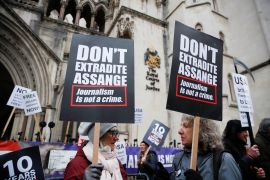 Supporters of WikiLeaks founder Julian Assange protest outside the Royal Courts of Justice in London, Britain