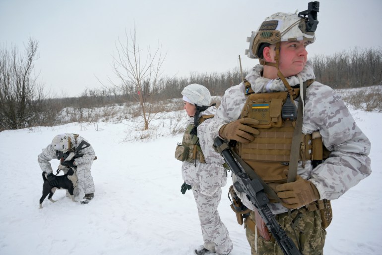 Service members of the Ukrainian armed forces are seen at combat positions near the line of separation from Russian-backed rebels in Donetsk Region, Ukraine