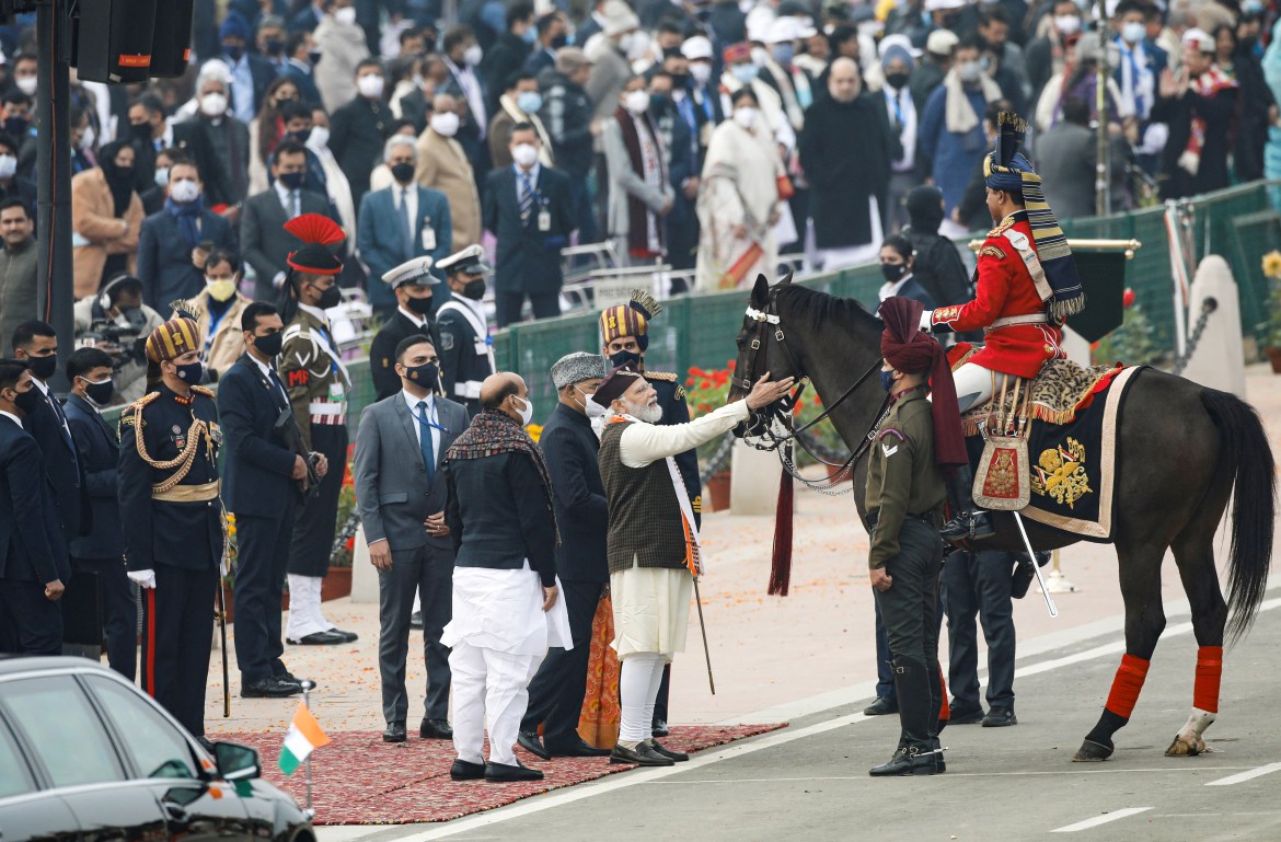 India's Prime Minister Narendra Modi talks to a presidential guard after the Republic Day parade in New Delhi
