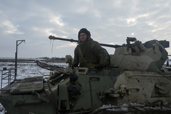 A Russian army service member is seen on an armoured personnel carrier BTR-82 during drills at the Kuzminsky range in the southern Rostov region