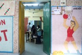 A woman receives a COVID-19 vaccine at a vaccination centre in New Delhi [Anushree Fadnavis/Reuters]
