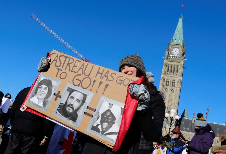 A protester in Ottawa holds a sign that reads, 'Castreau has got to go'