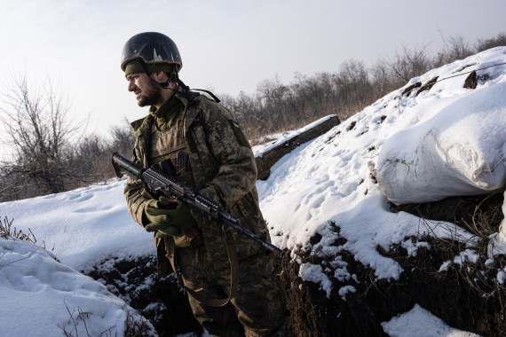 Ukrainian soldier holding his gun