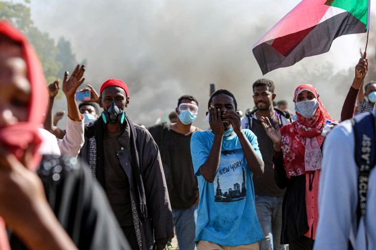 Security forces intervene as protesters in Khartoum march towards the Presidential Palace.