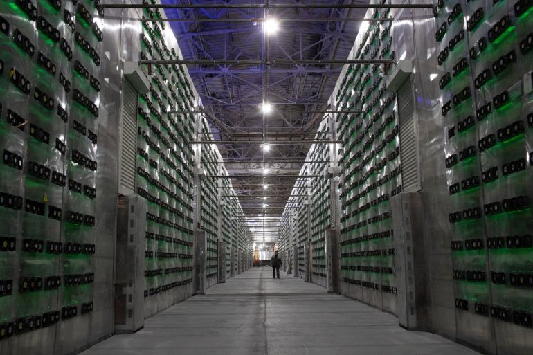 Racks of mining rigs at a cryptocurrency mining center in Nadvoitsy, Russia