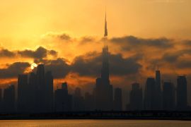 Downtown Dubai skyline with Burj Khalifa, at sunset
