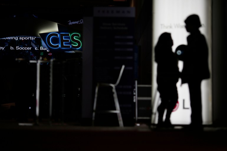 People walk around the Las Vegas Convention Center during pduring preparations for the 2019 CES