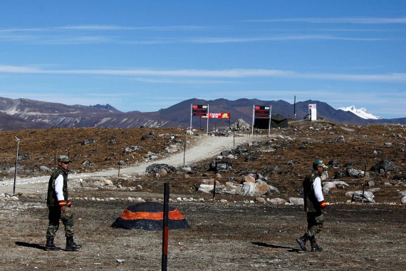 ndian army soldiers walk along the line of control at the India- China border in Bumla in the northeastern Indian state of Arunachal Pradesh