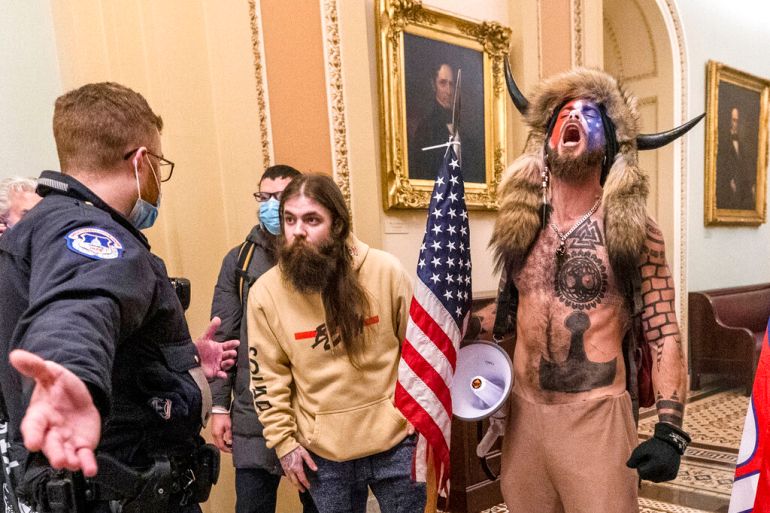 Jacob Chansley and other rioters inside the US Capitol