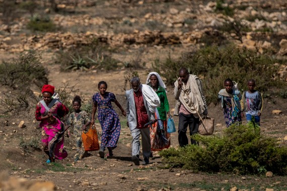 People walk to get food distributed in Tigray.