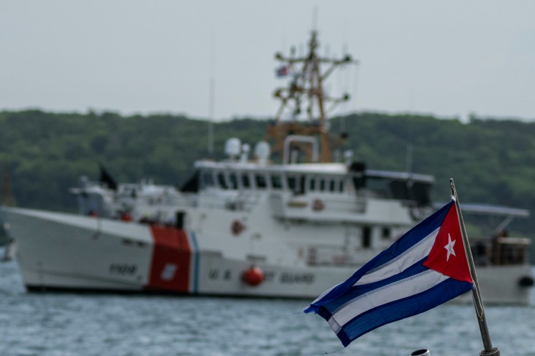 Cuban flag and boat in the background