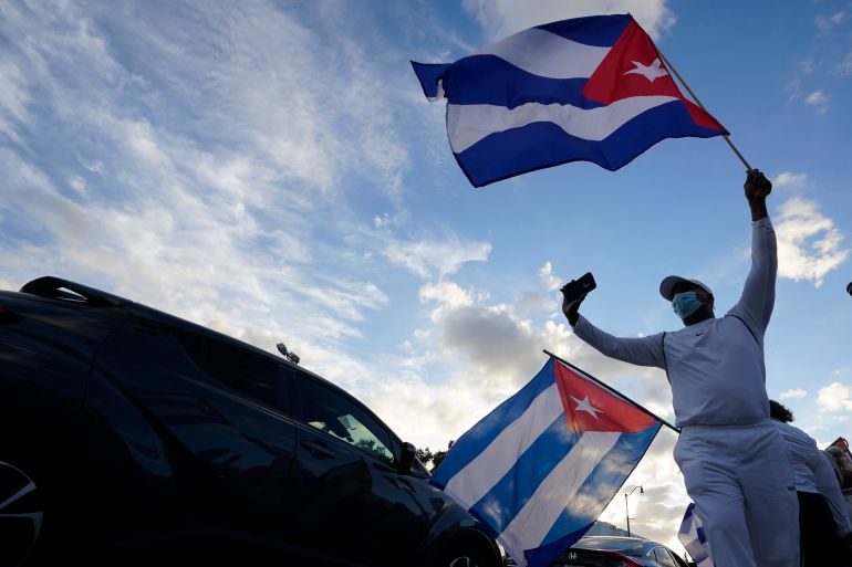 Protester waving Cuban flag in Miami