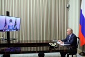 Russian President Vladimir Putin urged US President Joe Biden to make a legal pledge not to deploy forces and weapons to Ukraine during a videoconference in the Bocharov Ruchei residence in Sochi, Russia, Tuesday, December 7, 2021 [File: Mikhail Metzel, Sputnik, Kremlin Pool Photo via AP]