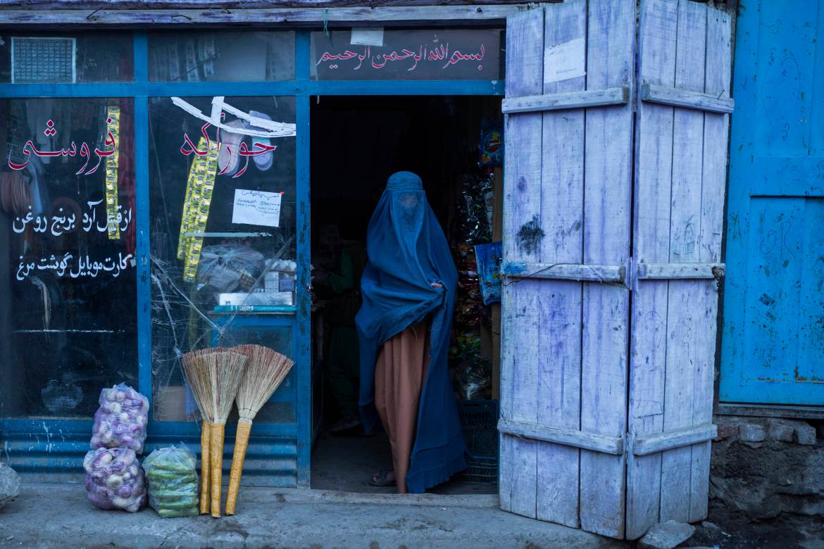 An Afghan woman at a shop in Kabul, Afghanistan