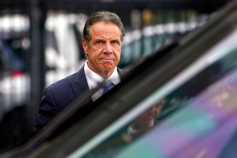 New York Governor Andrew Cuomo prepares to board a helicopter after announcing his resignation on August 10.