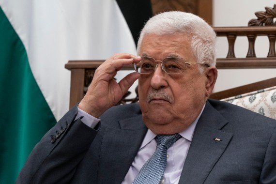 Palestinian President Mahmoud Abbas adjusts his glasses as he listens during a joint statement with Secretary of State Antony Blinken, Tuesday, May 25, 2021, in West Bank city of Ramallah. Abbas met with Israeli Defense Minister Benny Gantz at Gantz's private residence in a Tel Aviv suburb late Tuesday, Dec. 28, 2021. The two discussed security coordination