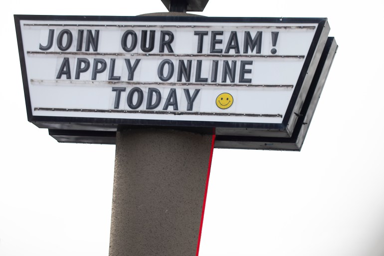 A sign seeking workers is displayed at a fast food restaurant in Portland, Oregon, US