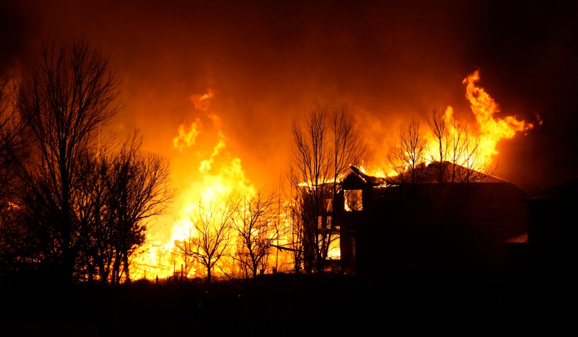 Homes burn as wildfires rip through a housing development in Colorado